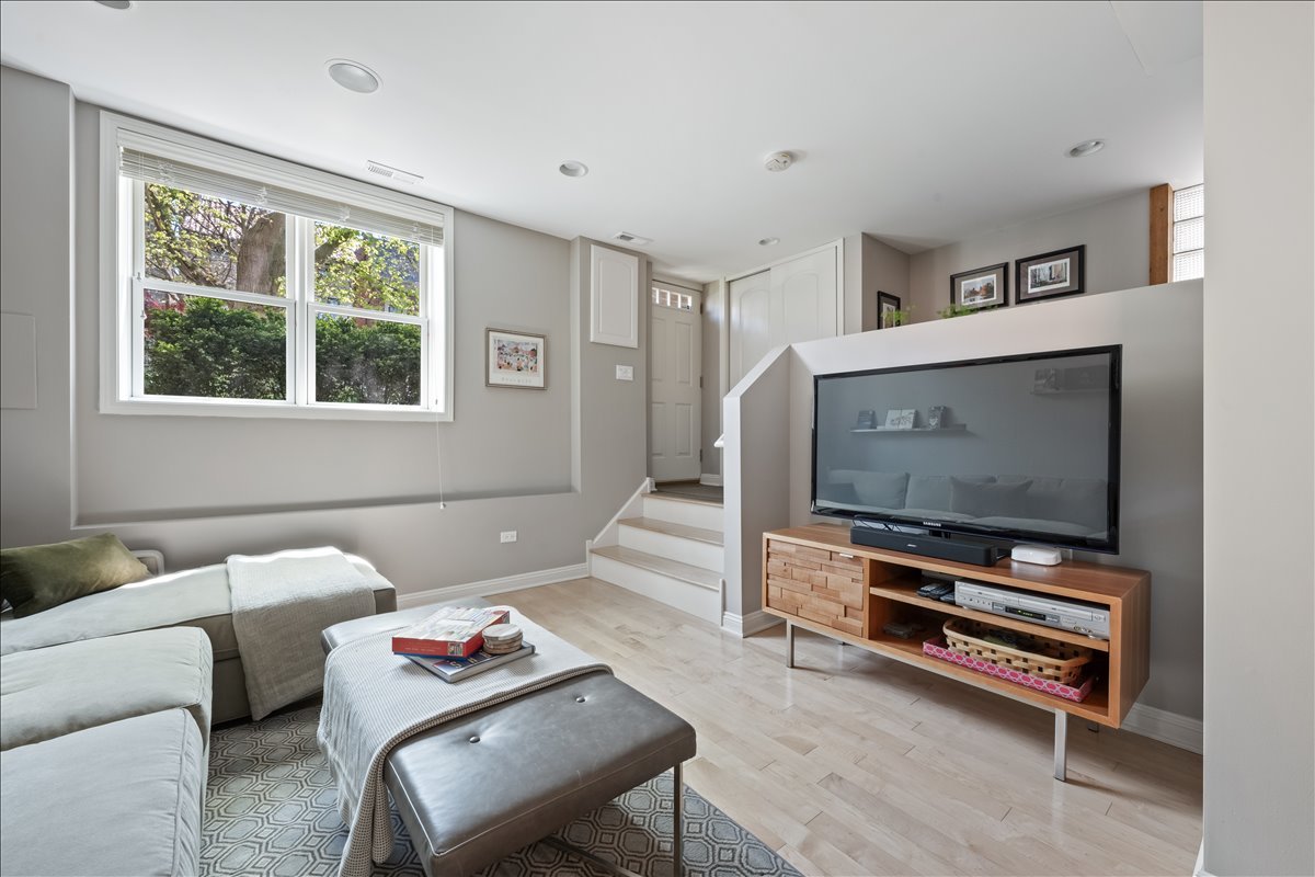 1332 West School Street Chicago, IL 60657 - Photo 34 of 45 a living room with furniture and a flat screen tv