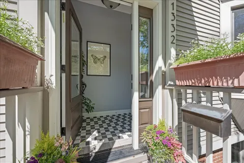 a view of a house with a potted plant