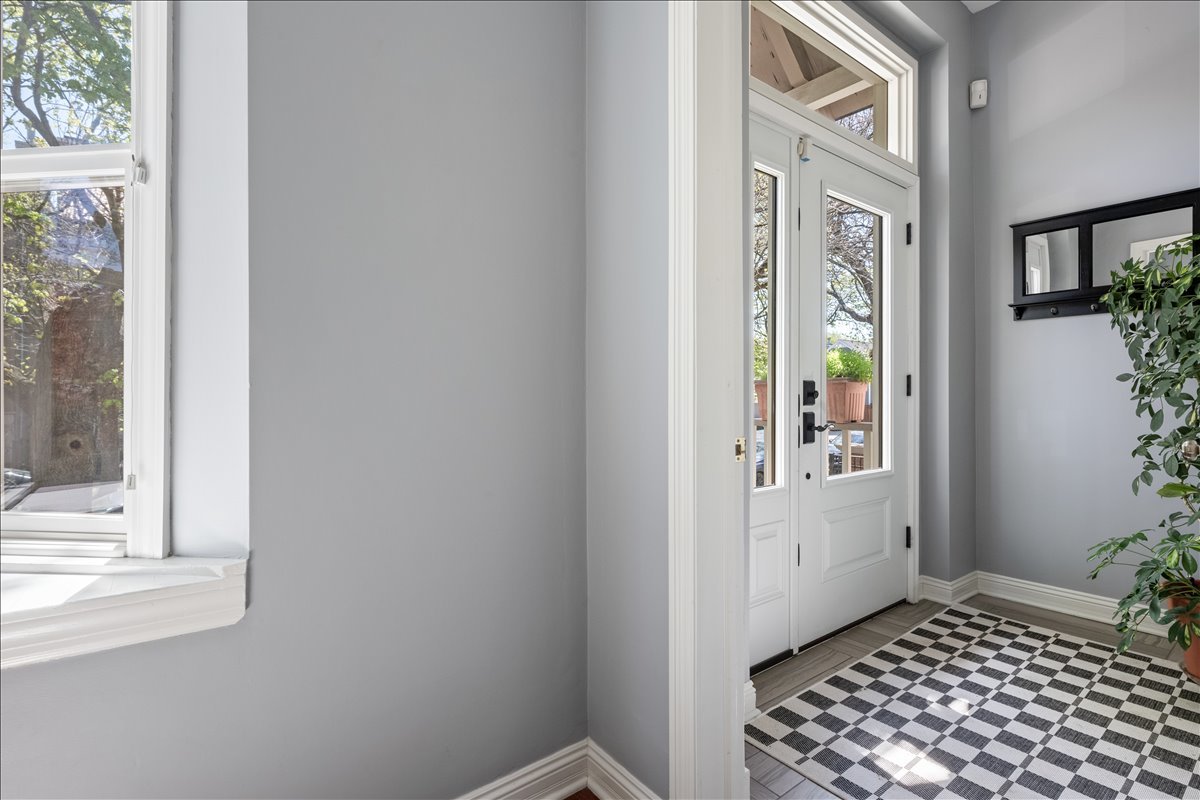 1332 West School Street Chicago, IL 60657 - Photo 9 of 45 a view of a hallway with wooden floor and a bathroom