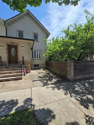 a view of living room with furniture and floor to ceiling window
