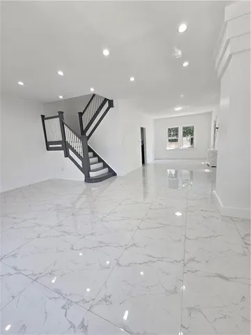 a view of a hall with stairs