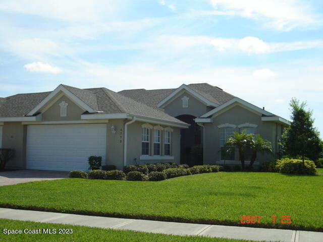 4370 Aberdeen Circle Rockledge, FL 32955 - Photo 1 of 58 front view of house with a yard