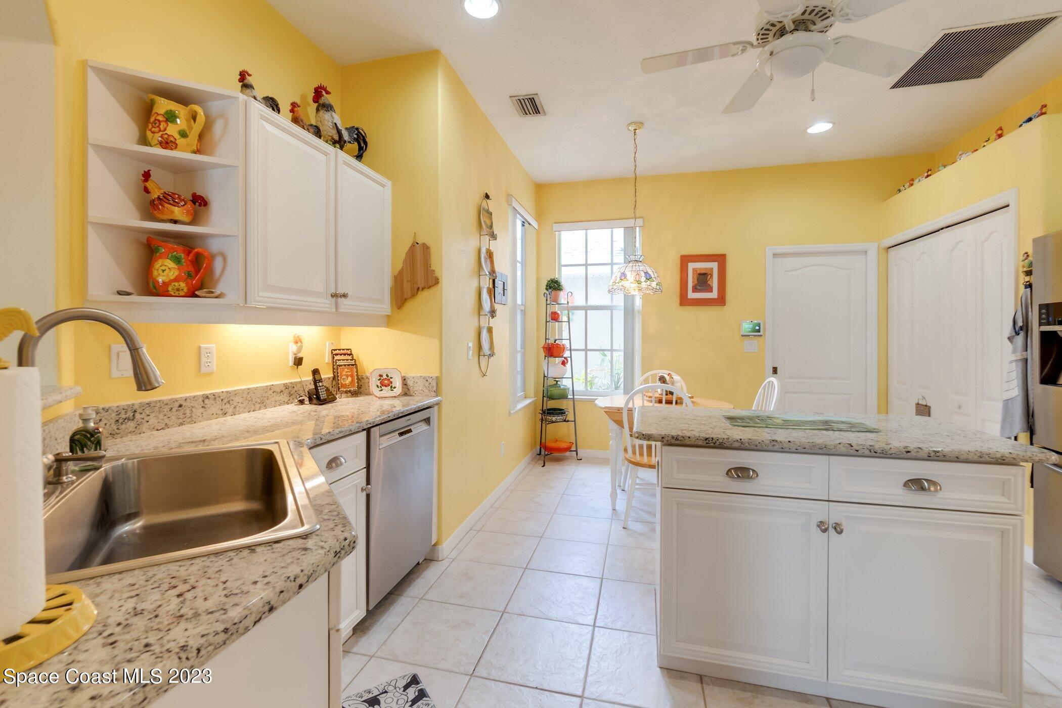 4370 Aberdeen Circle Rockledge, FL 32955 - Photo 15 of 58 a spacious bathroom with a granite countertop sink a toilet and shower