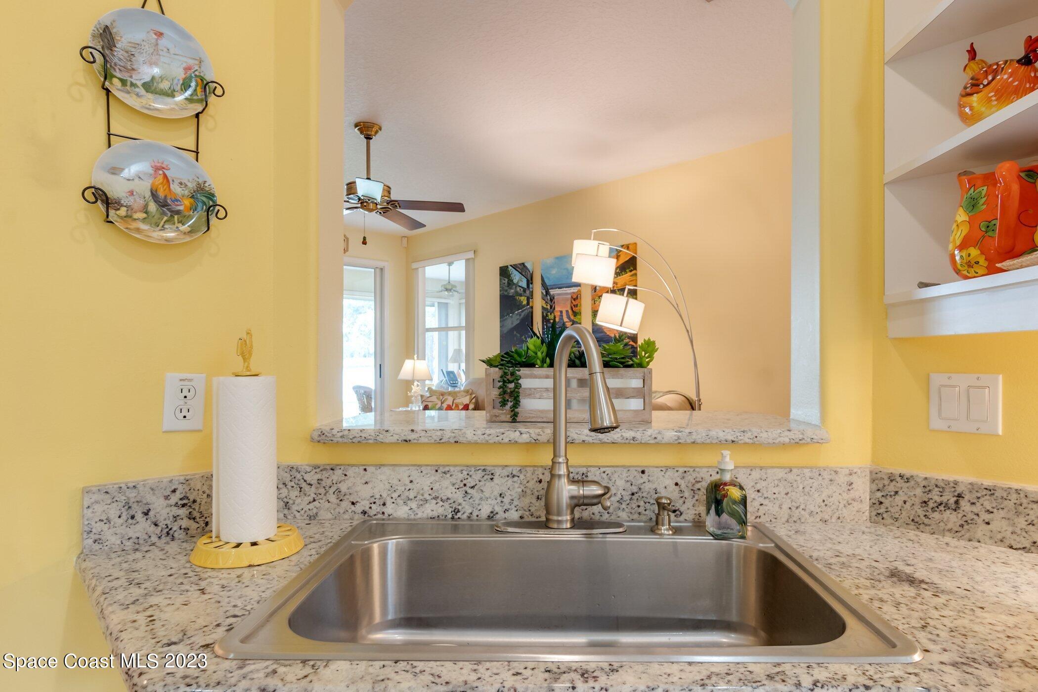 4370 Aberdeen Circle Rockledge, FL 32955 - Photo 16 of 58 a kitchen with a sink and a window