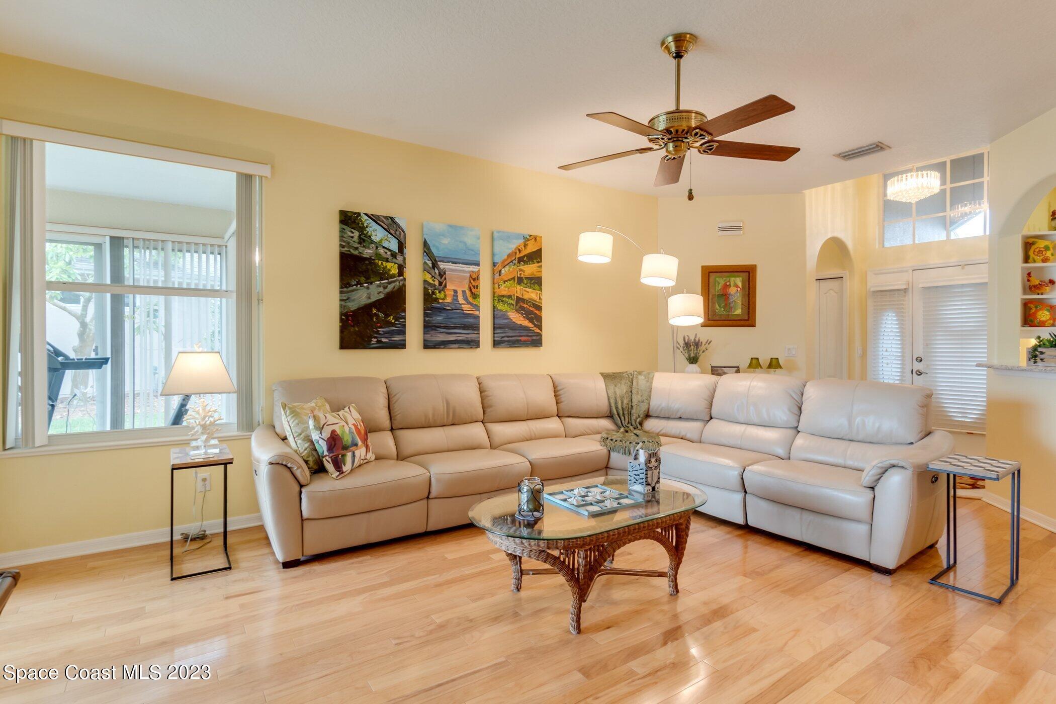 4370 Aberdeen Circle Rockledge, FL 32955 - Photo 17 of 58 a living room with furniture and a large window