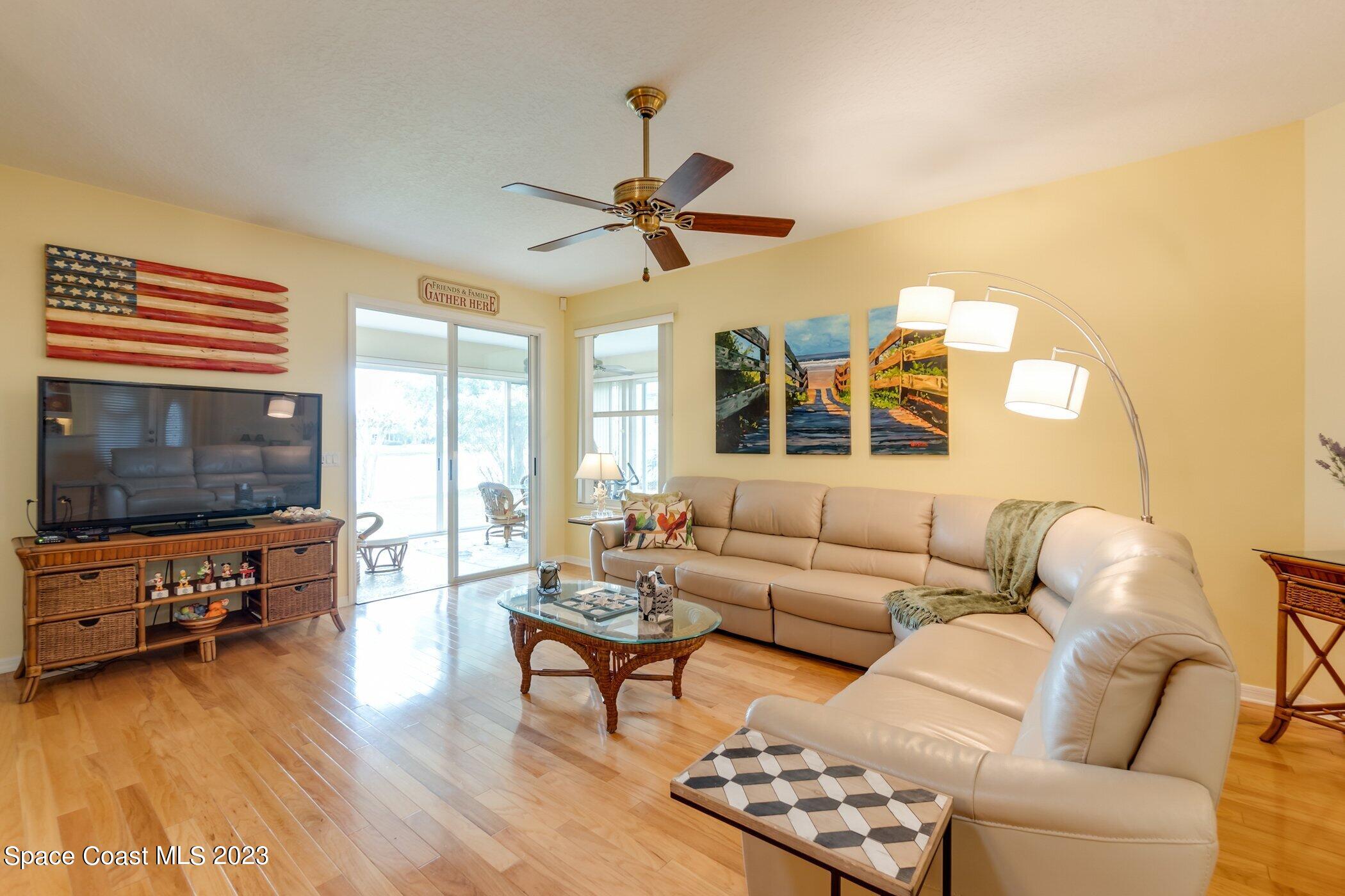 4370 Aberdeen Circle Rockledge, FL 32955 - Photo 19 of 58 a living room with furniture and a flat screen tv