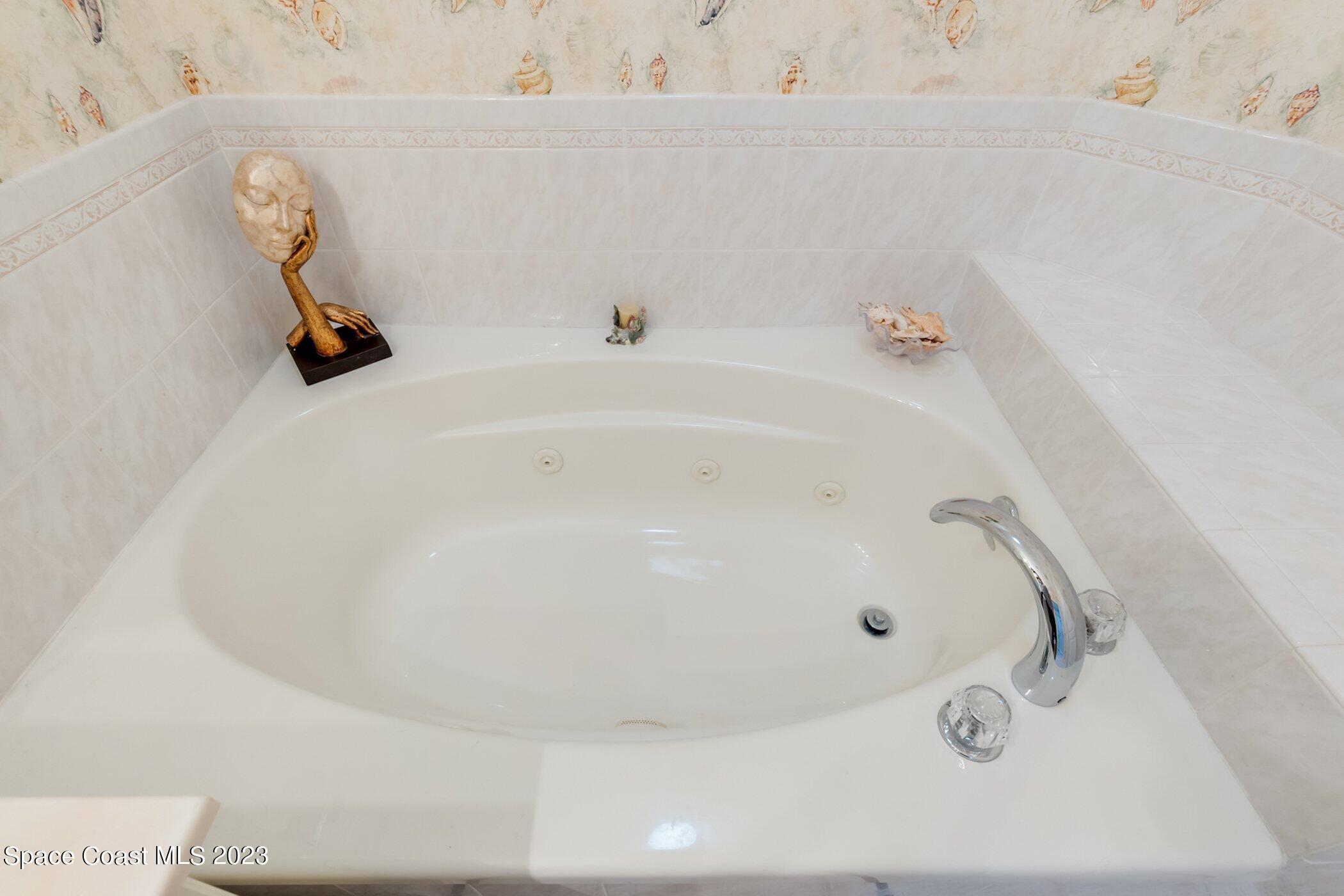 4370 Aberdeen Circle Rockledge, FL 32955 - Photo 22 of 58 a bath tub sitting next to a white sink