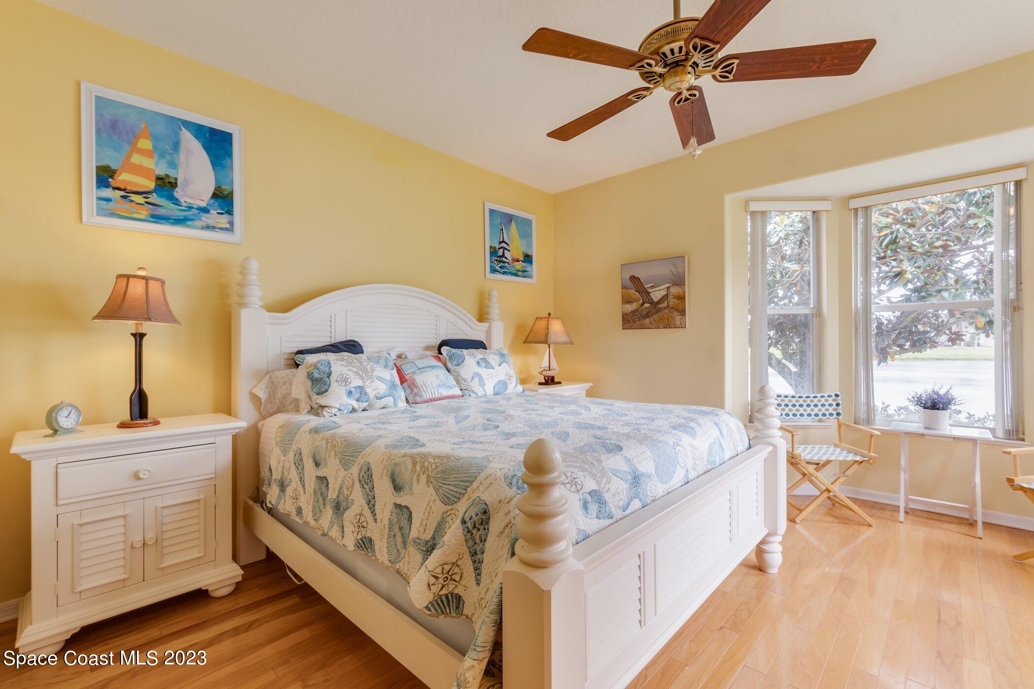 4370 Aberdeen Circle Rockledge, FL 32955 - Photo 23 of 58 a bedroom with a bed and a cabinets