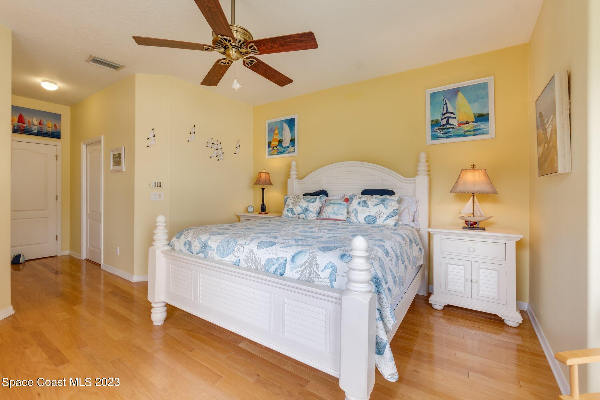 4370 Aberdeen Circle Rockledge, FL 32955 - Photo 24 of 58 a bedroom with a bed and a table