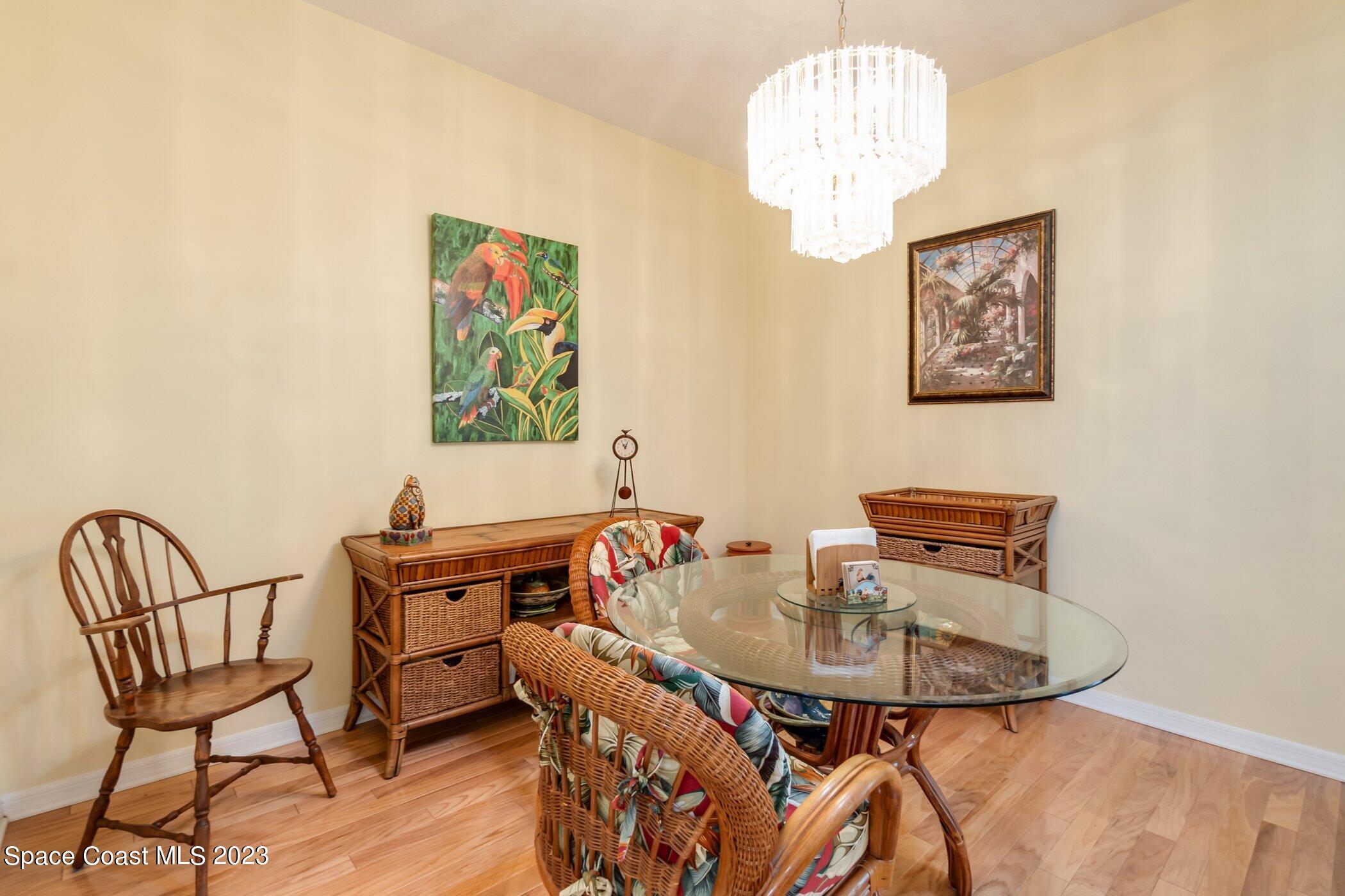 4370 Aberdeen Circle Rockledge, FL 32955 - Photo 27 of 58 a dining room with furniture and wooden floor