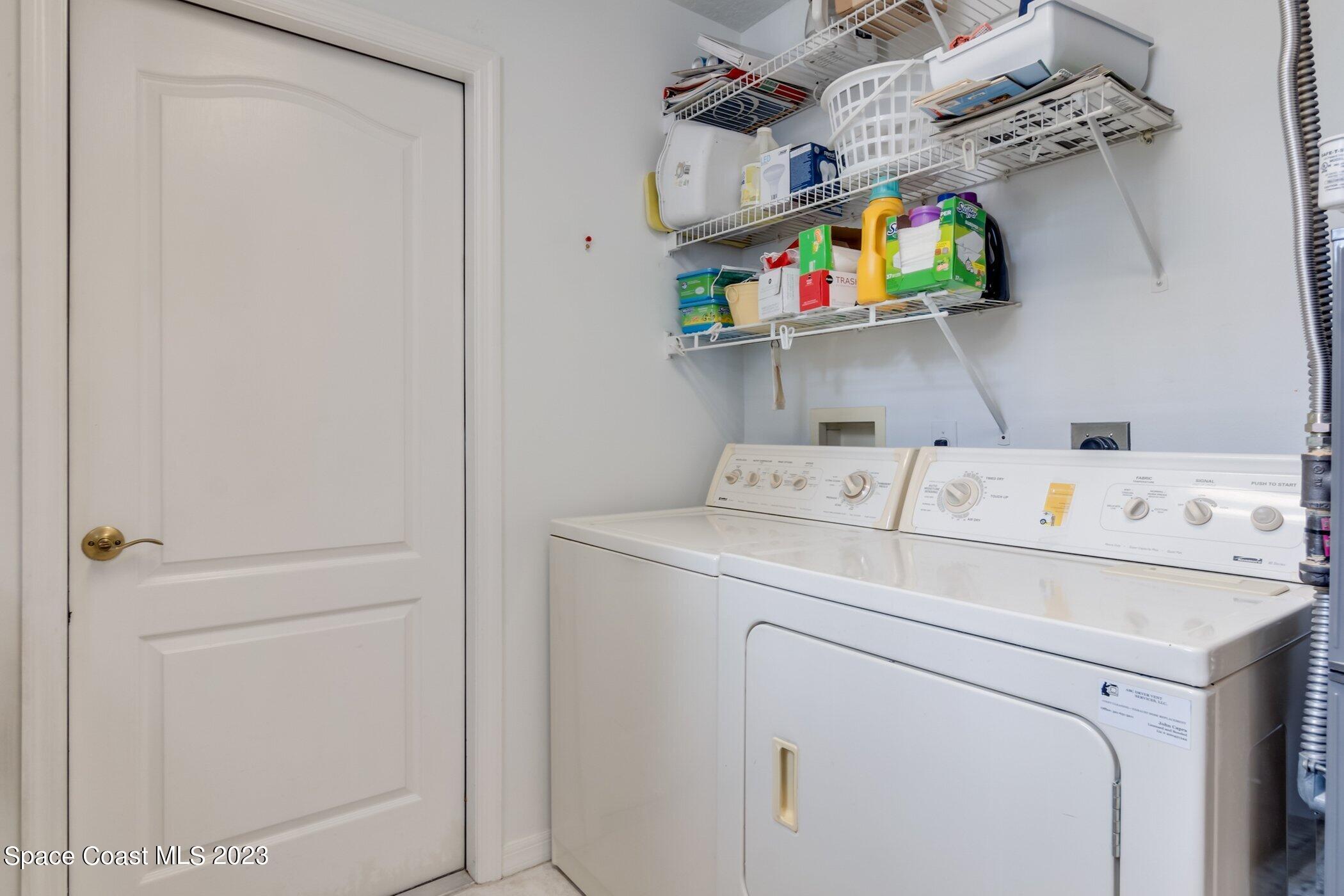 4370 Aberdeen Circle Rockledge, FL 32955 - Photo 28 of 58 a utility room with dryer and washer