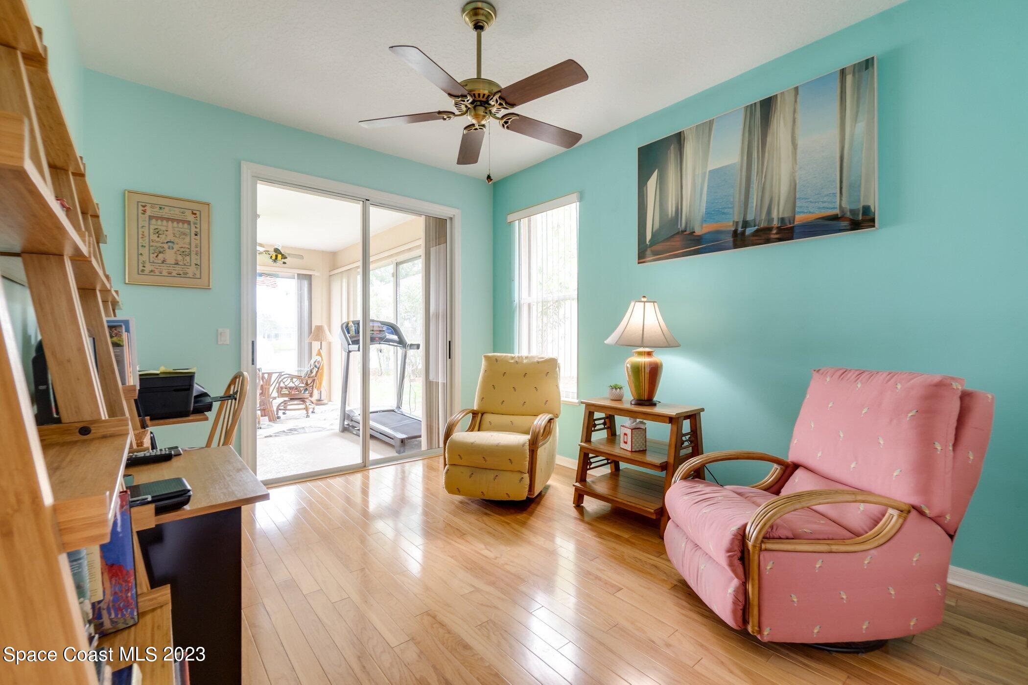 4370 Aberdeen Circle Rockledge, FL 32955 - Photo 32 of 58 a living room with furniture and a flat screen tv