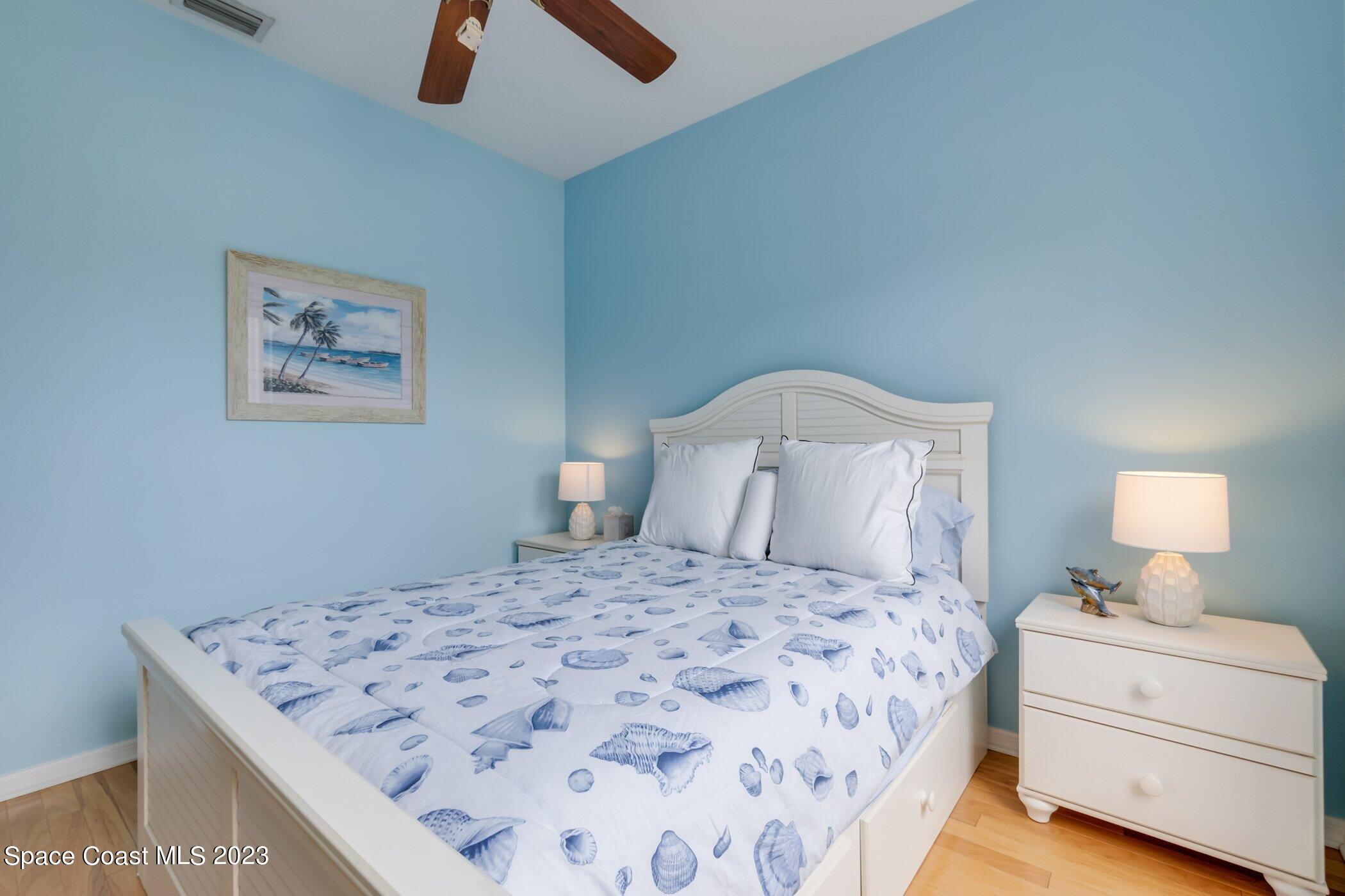 4370 Aberdeen Circle Rockledge, FL 32955 - Photo 35 of 58 a bedroom with a bed and a lamp