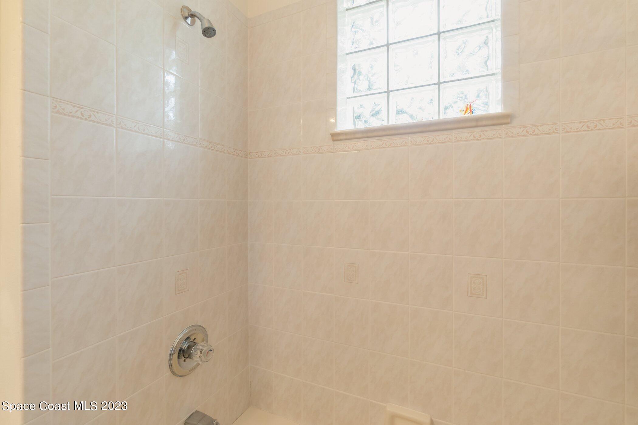 4370 Aberdeen Circle Rockledge, FL 32955 - Photo 36 of 58 a bathroom with a window