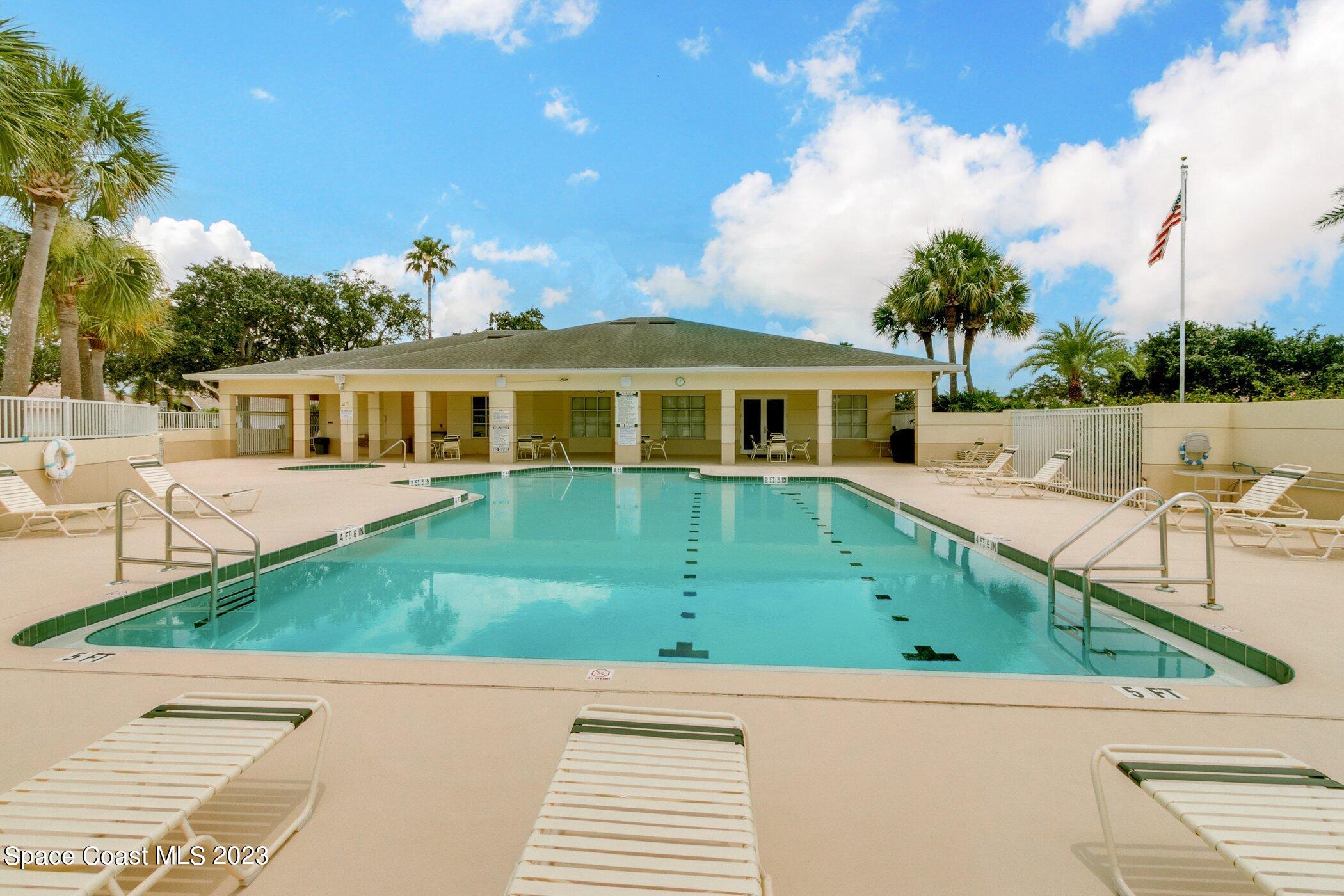 4370 Aberdeen Circle Rockledge, FL 32955 - Photo 43 of 58 a view of a white house with a yard