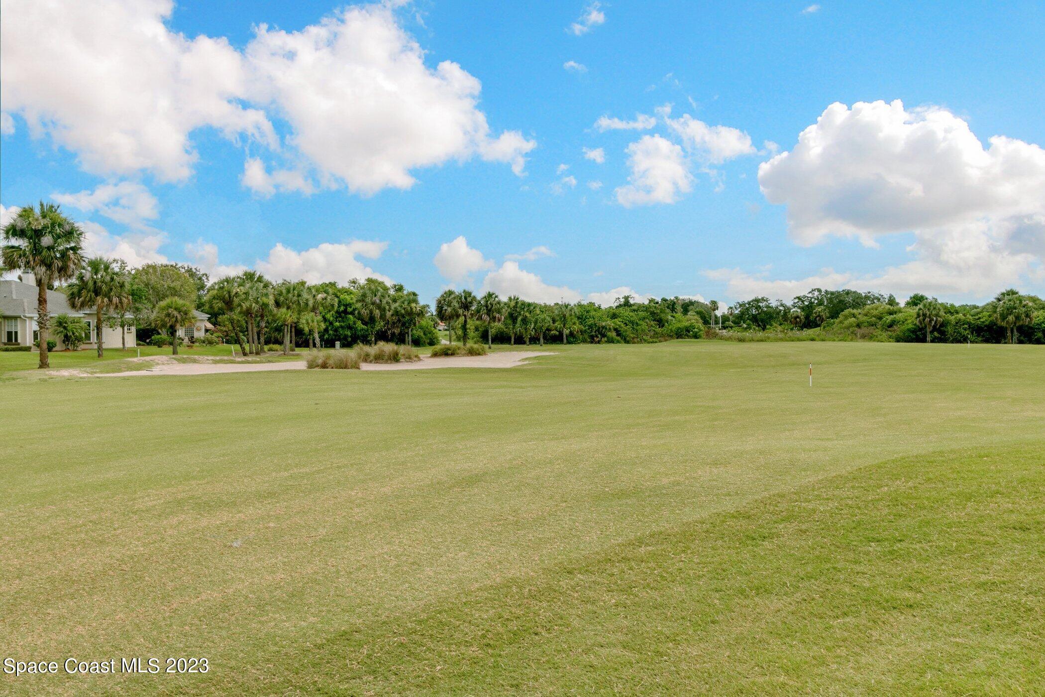 4370 Aberdeen Circle Rockledge, FL 32955 - Photo 48 of 58 a view of a lake and a houses