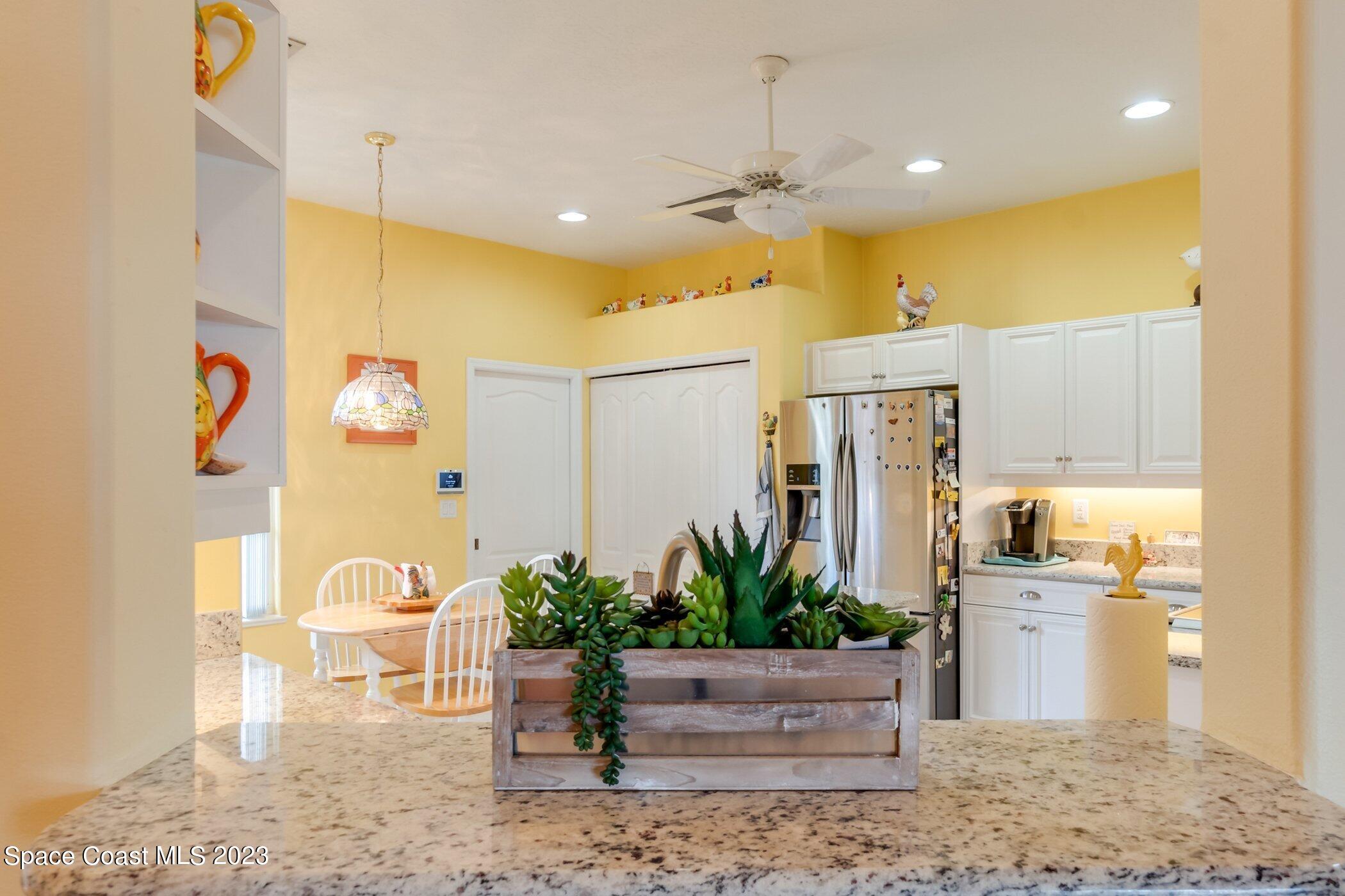 4370 Aberdeen Circle Rockledge, FL 32955 - Photo 5 of 58 a view of a living room and kitchen view