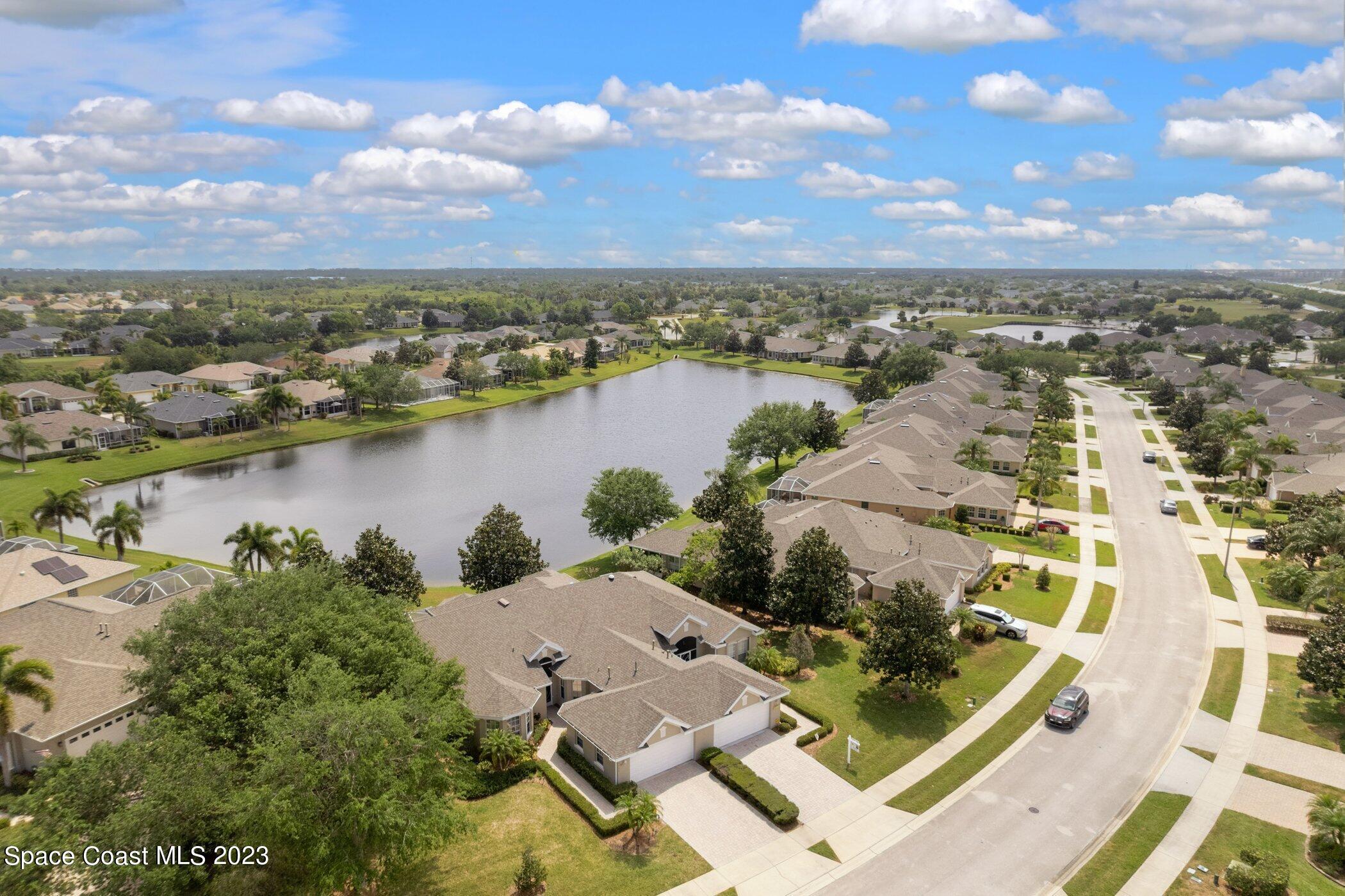 4370 Aberdeen Circle Rockledge, FL 32955 - Photo 8 of 58 an aerial view of residential building with outdoor space and lake view