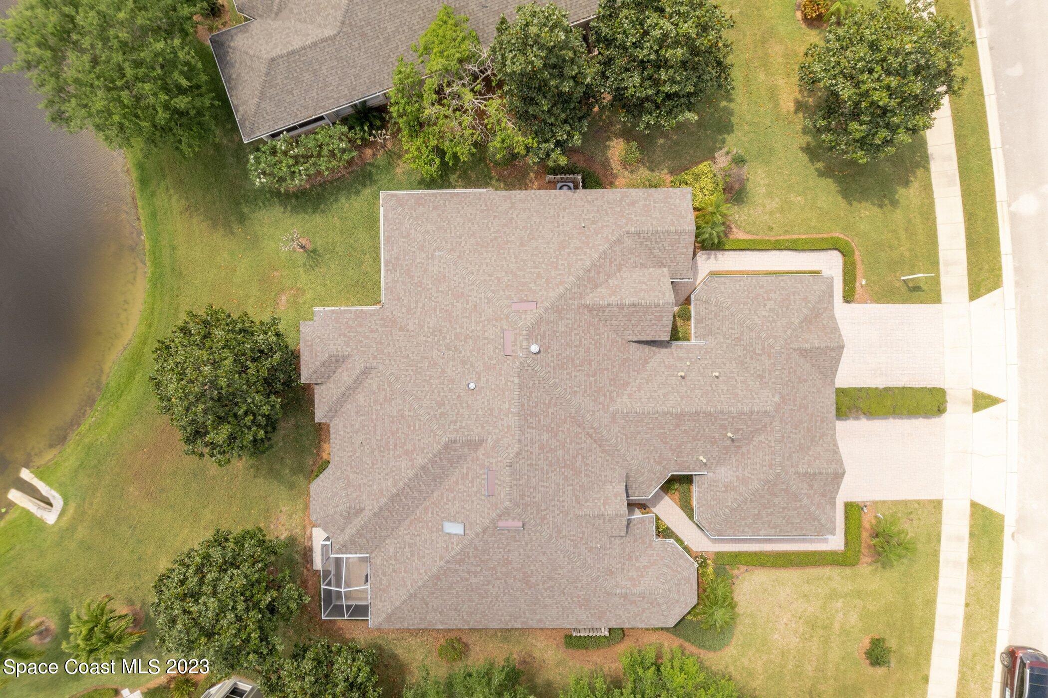 4370 Aberdeen Circle Rockledge, FL 32955 - Photo 9 of 58 an aerial view of a house with a yard