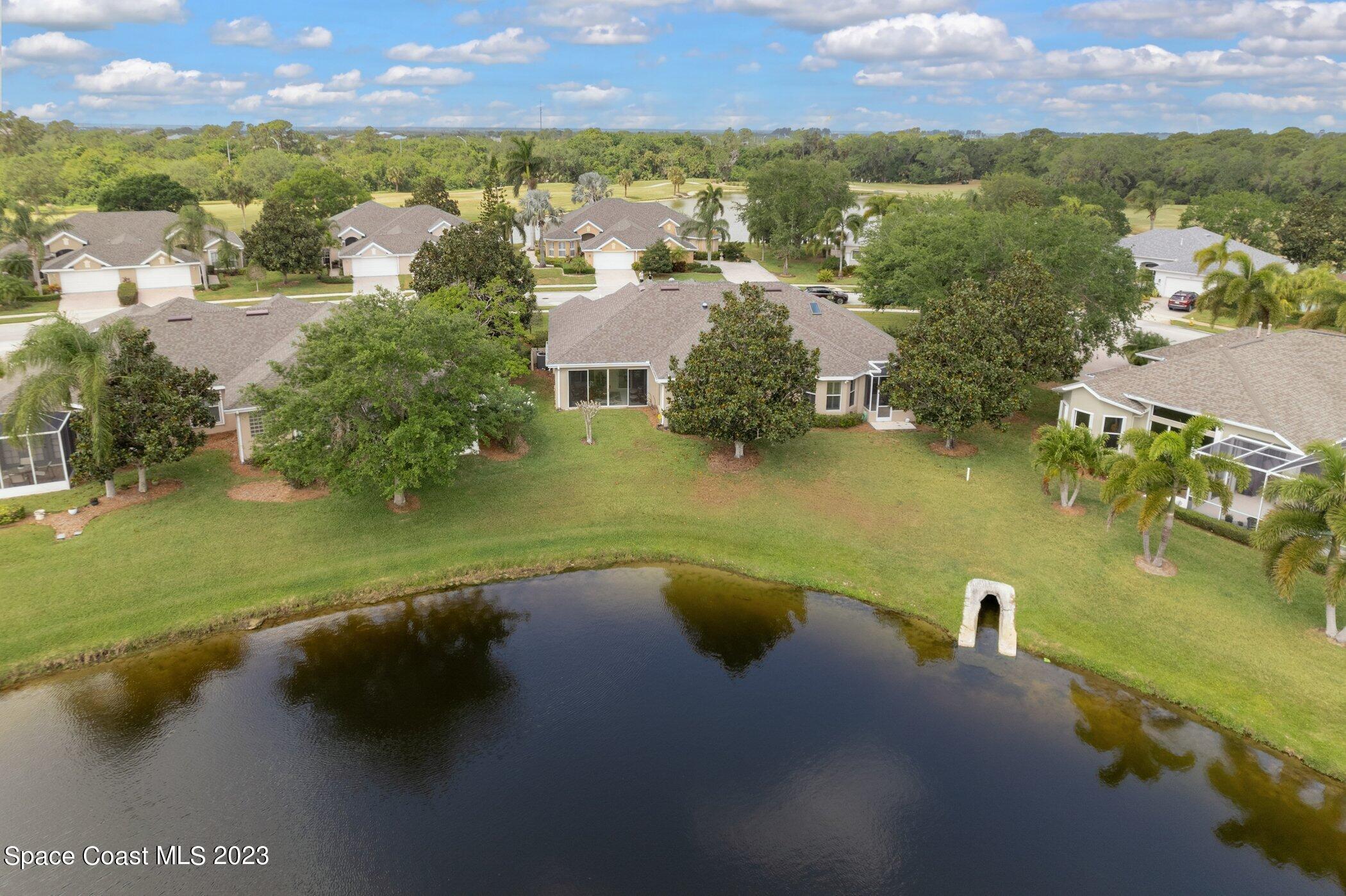 4370 Aberdeen Circle Rockledge, FL 32955 - Photo 10 of 58 an aerial view of residential houses with outdoor space and lake view