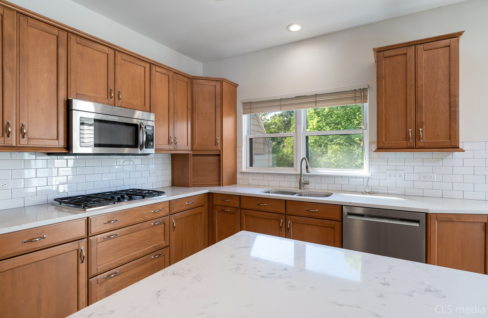 3540 Patten Road Highland Park, IL 60035 - Photo 11 of 30 a kitchen with stainless steel appliances granite countertop a sink and cabinets