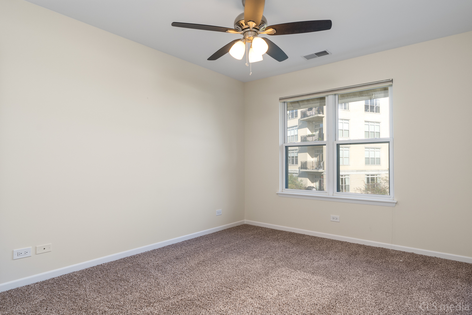 3540 Patten Road Highland Park, IL 60035 - Photo 24 of 30 an empty room with a window and a fan