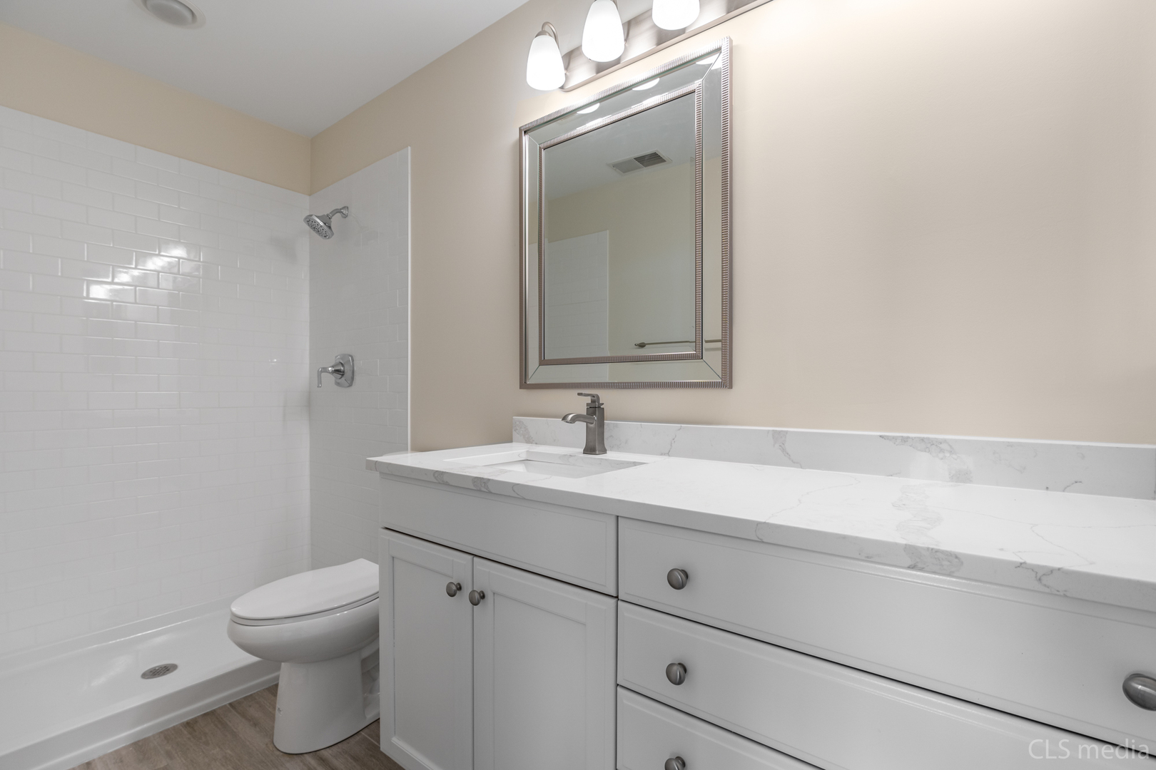 3540 Patten Road Highland Park, IL 60035 - Photo 27 of 30 a bathroom with a toilet a sink a vanity and mirror