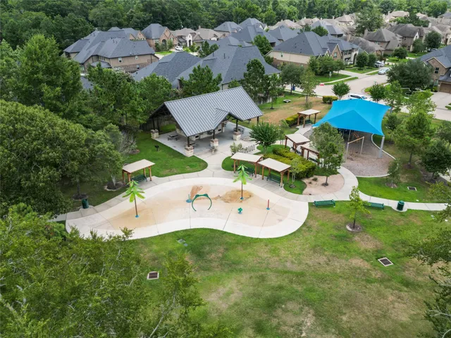 an aerial view of a house with yard swimming pool and outdoor seating