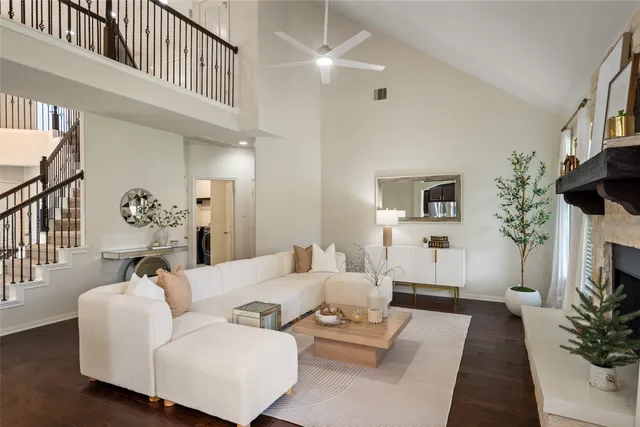 a living room with furniture flower pot and a fireplace