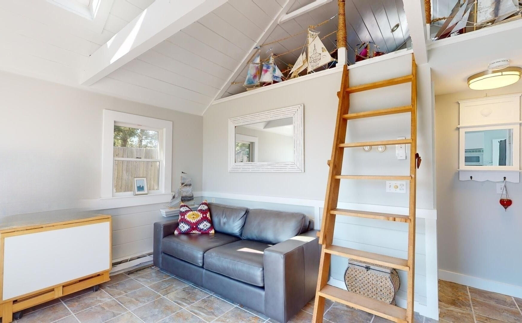 596 Shore Road, Unit H Truro, MA 02666 - Photo 17 of 30 a living room with furniture and a window