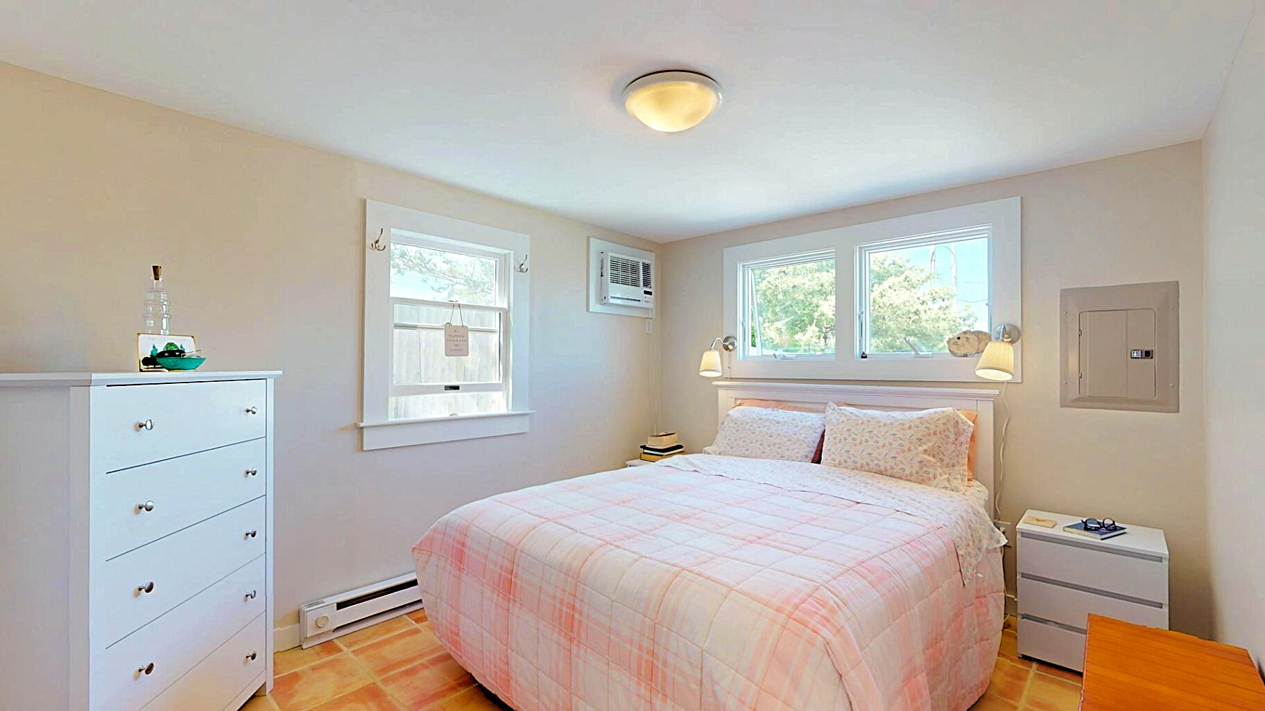 596 Shore Road, Unit H Truro, MA 02666 - Photo 19 of 30 a bedroom with a bed and a window