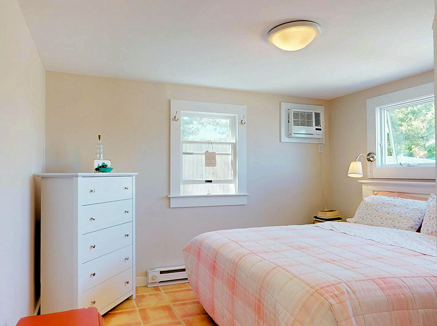 596 Shore Road, Unit H Truro, MA 02666 - Photo 20 of 30 a bedroom with a bed and a window