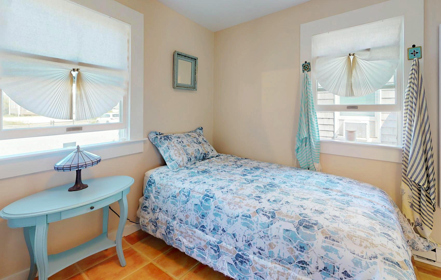 596 Shore Road, Unit H Truro, MA 02666 - Photo 25 of 30 a bedroom with a bed and a window