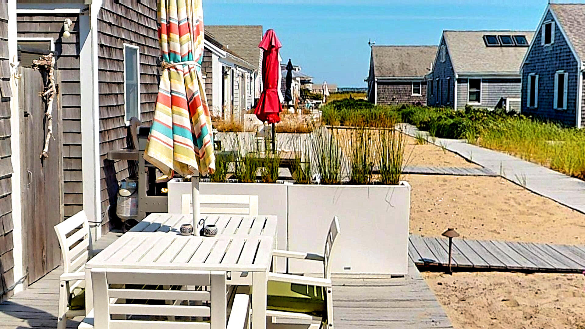 596 Shore Road, Unit H Truro, MA 02666 - Photo 3 of 30 a view of a building with outdoor space