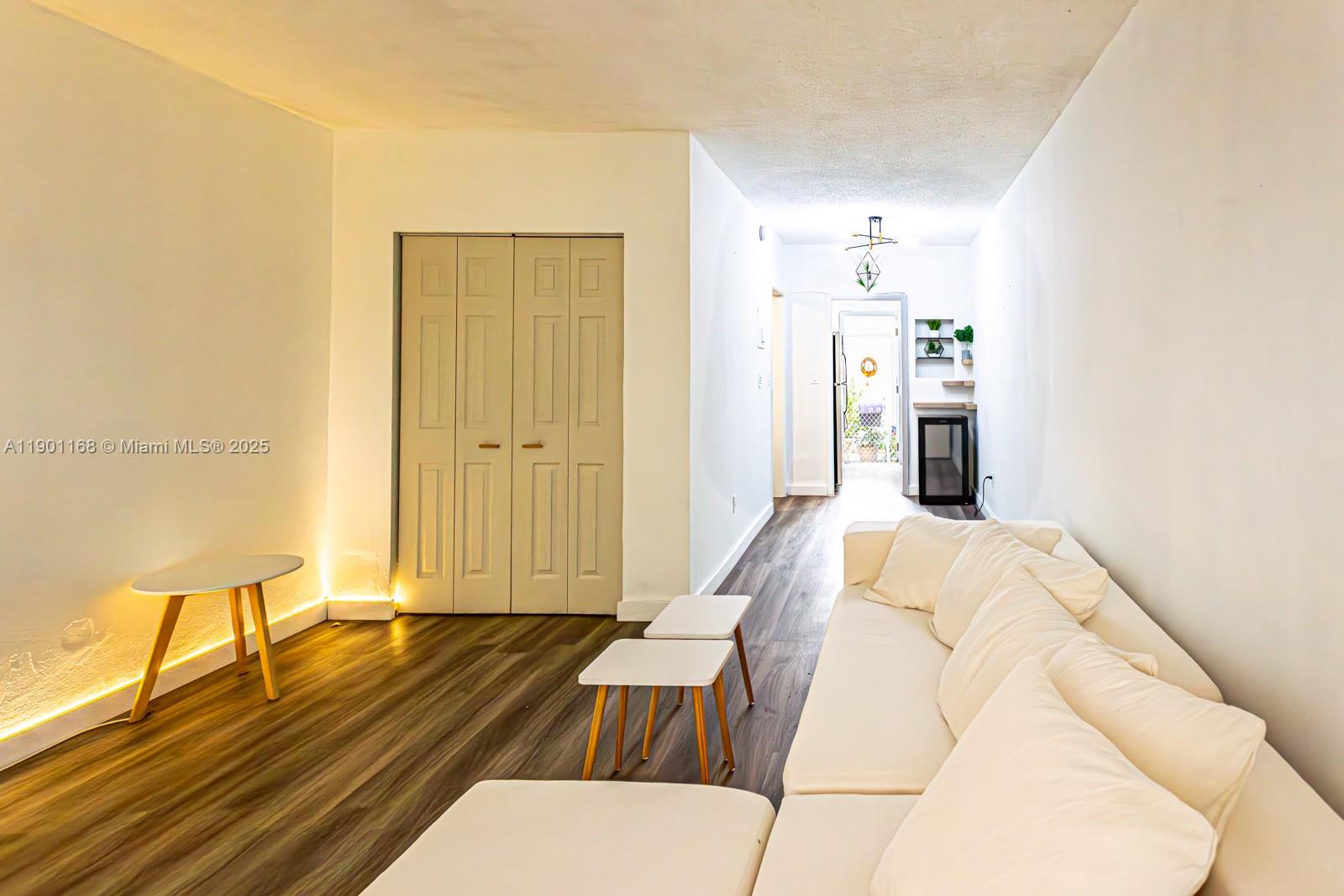 7720 Harding Avenue, Unit 3 Miami Beach, FL 33141 - Photo 4 of 15 a bed room with a bed