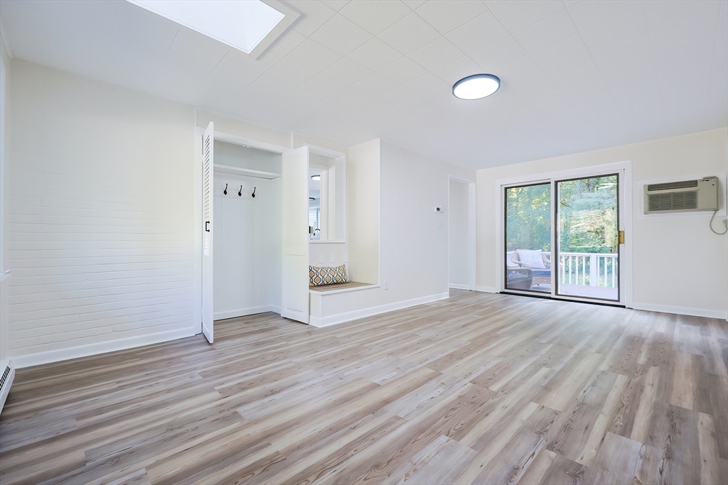 16 Deerfield Road Sharon, MA 02067 - Photo 11 of 38 an empty room with wooden floor and windows