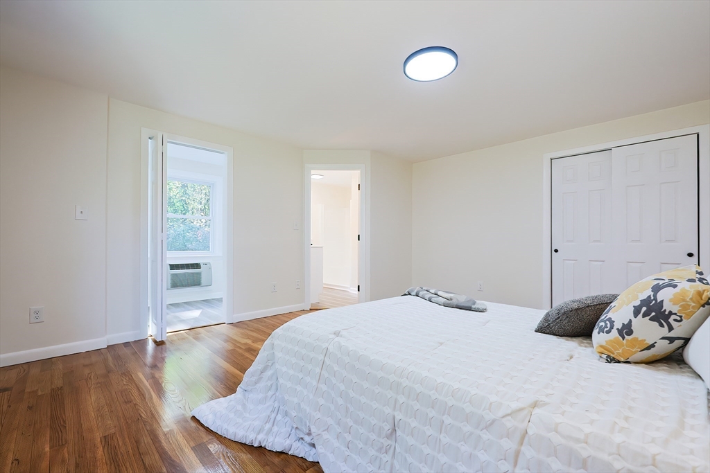 16 Deerfield Road Sharon, MA 02067 - Photo 15 of 38 a bedroom with a bed and a window