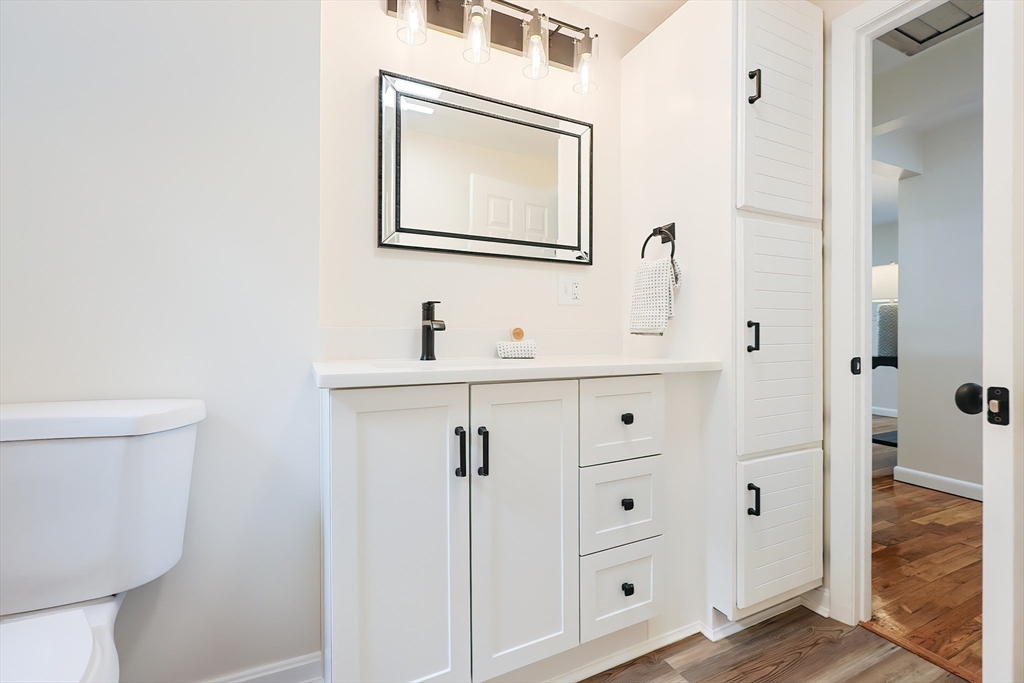 16 Deerfield Road Sharon, MA 02067 - Photo 20 of 38 a bathroom with a sink a toilet and shower