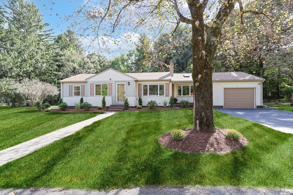 16 Deerfield Road Sharon, MA 02067 - Photo 2 of 38 a front view of a house with a yard table and chairs
