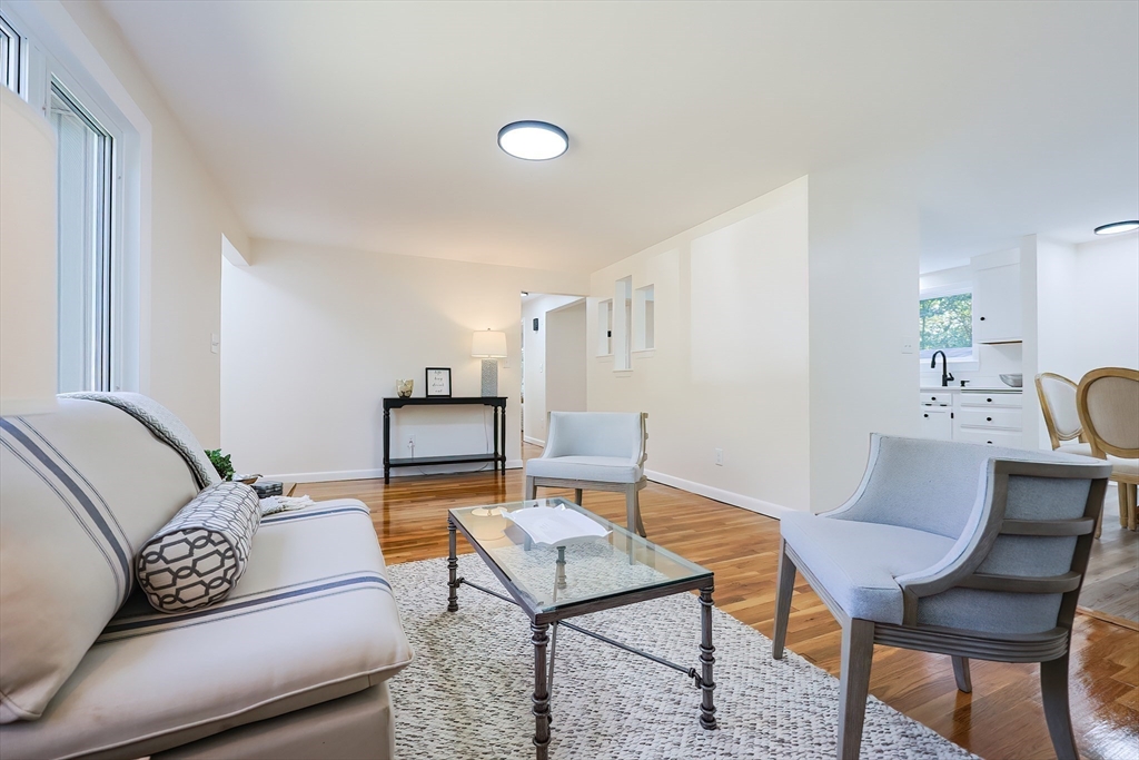16 Deerfield Road Sharon, MA 02067 - Photo 7 of 38 a living room with furniture and a table
