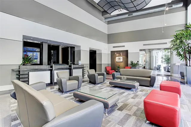 a front view of a building with a window and a potted plant