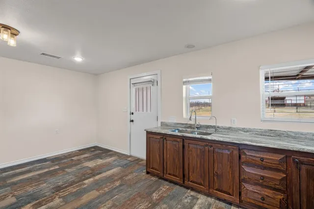 a kitchen with stainless steel appliances a stove a refrigerator and a sink
