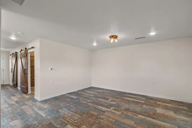 an empty room with closet area