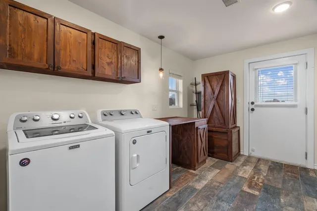 a view of an empty room with a white building