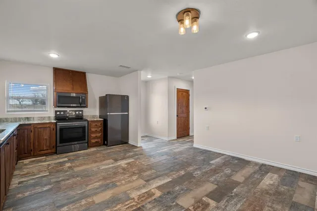a kitchen with stainless steel appliances a refrigerator and a sink