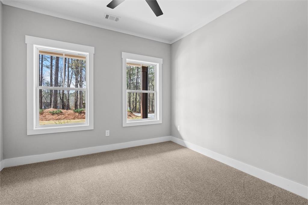 6093 Wayfarer Drive Villa Rica, GA 30180 - Photo 27 of 70 an empty room with windows