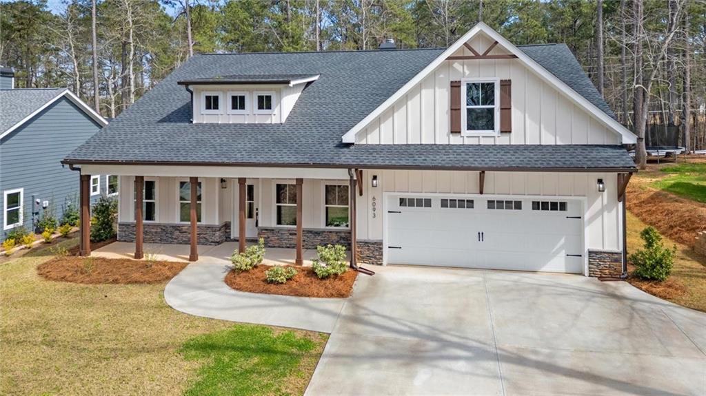 6093 Wayfarer Drive Villa Rica, GA 30180 - Photo 3 of 70 a view of a white house with swimming pool lawn chairs and wooden fence