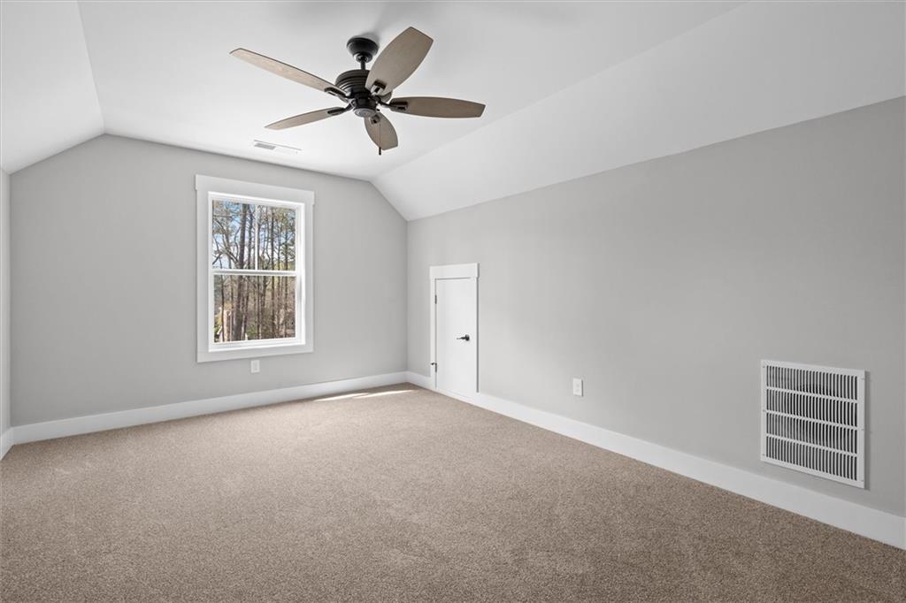 6093 Wayfarer Drive Villa Rica, GA 30180 - Photo 33 of 70 a view of a livingroom with a ceiling fan and window