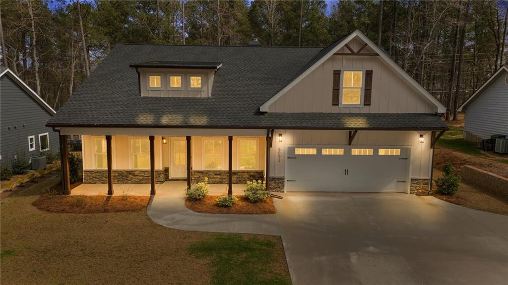 6093 Wayfarer Drive Villa Rica, GA 30180 - Photo 4 of 70 a front view of a house with a yard