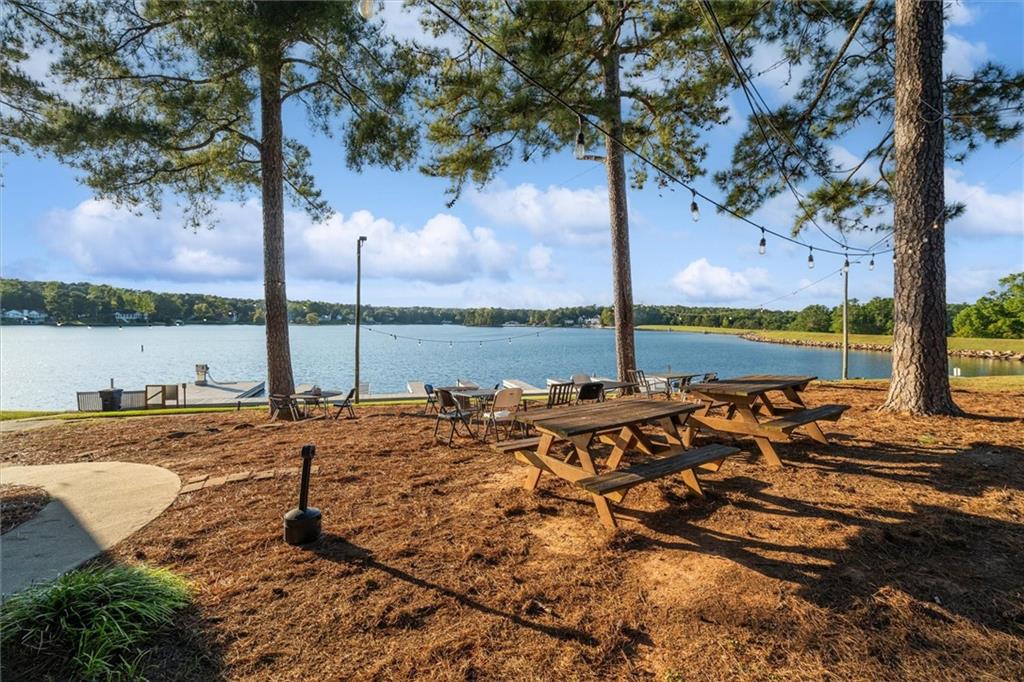 6093 Wayfarer Drive Villa Rica, GA 30180 - Photo 60 of 70 a view of a lake with houses in the background